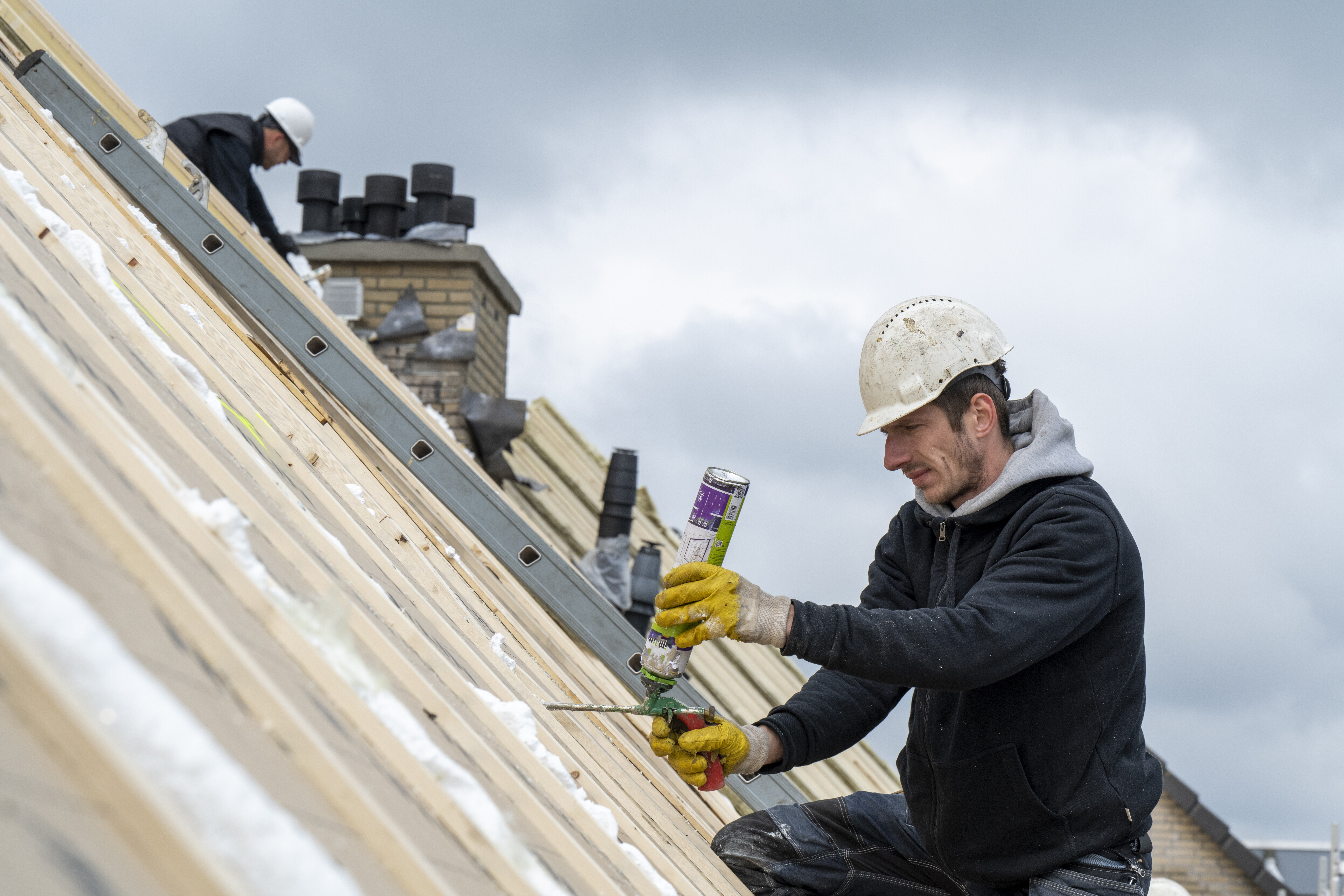 Professional team installing new quality roof