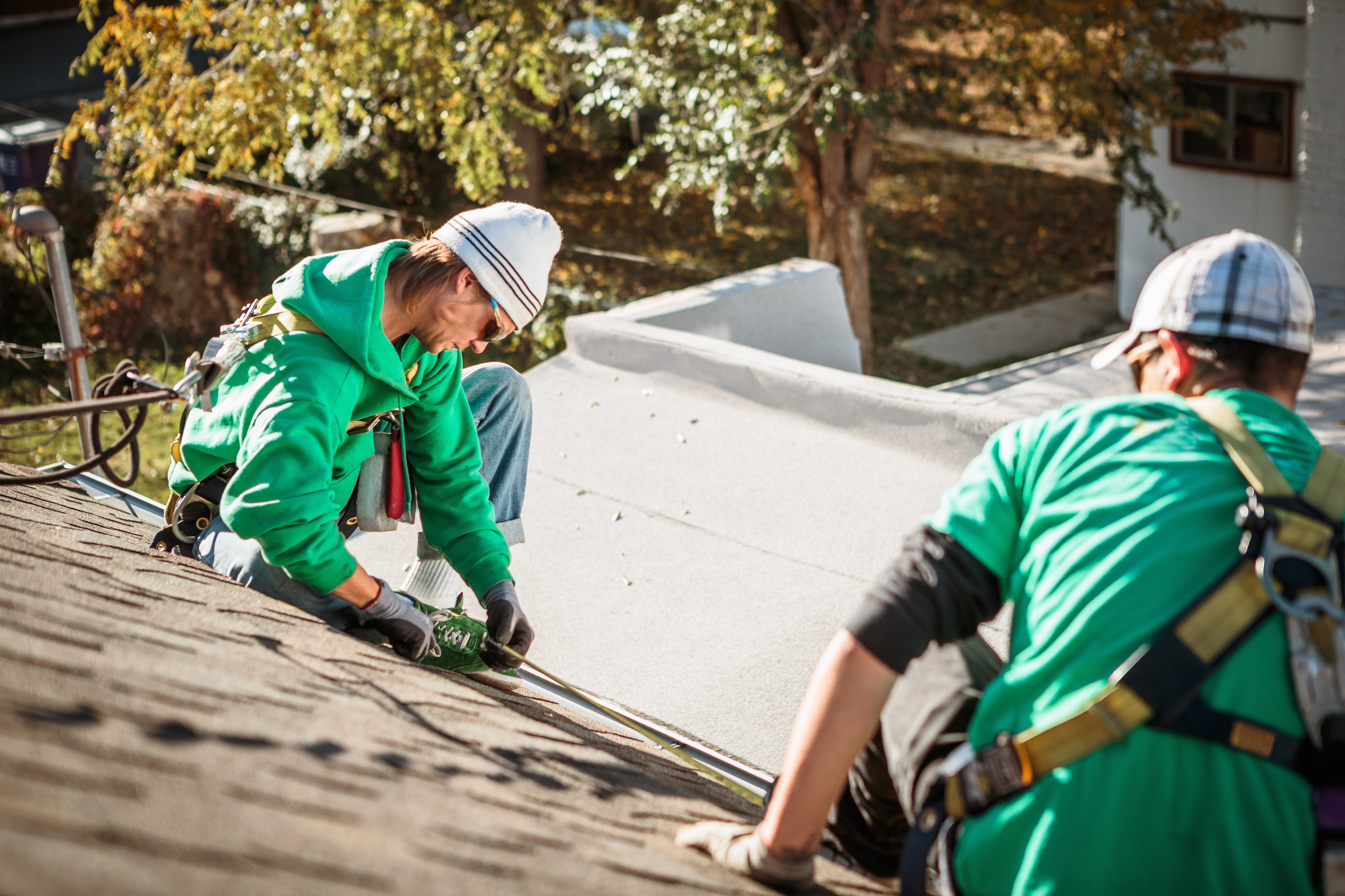 Solar panel installation team working on residential roof